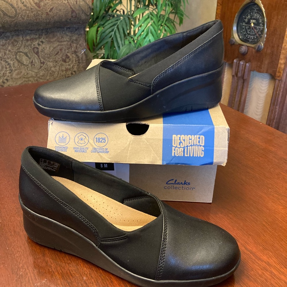 Clark’s Suttyn walk black slip on wedge shoe size 8M
New in box